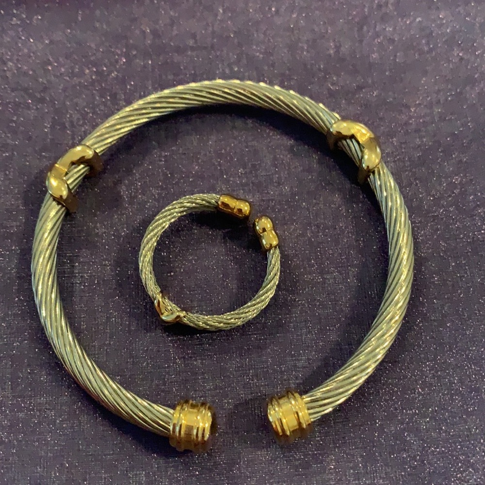 Silver and gold tone bracelet and ring.